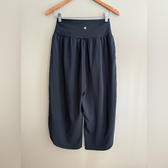 HALARA Black Cropped Pants with an Asymmetrical Bottom and Crisscross Front - Picture 15 of 17